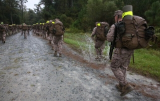 Marine on a hump through wet terrain